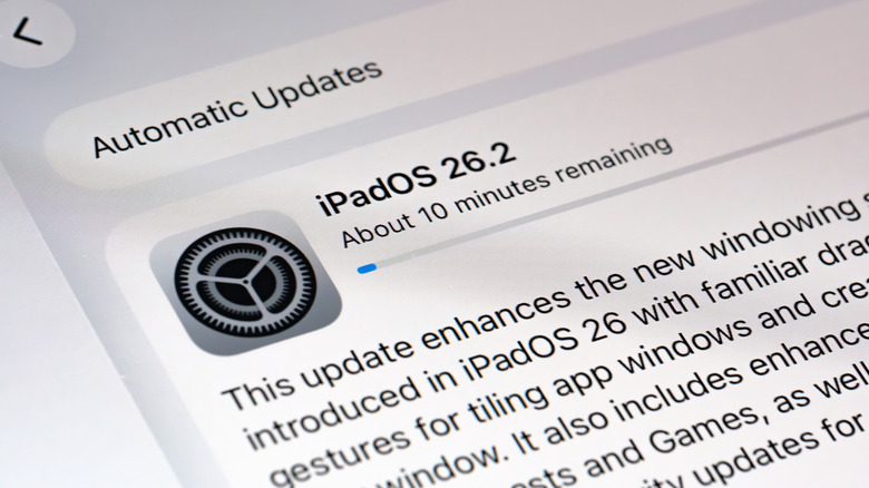 A close up view of an iPad screen displaying the iPadOS software update progress bar.