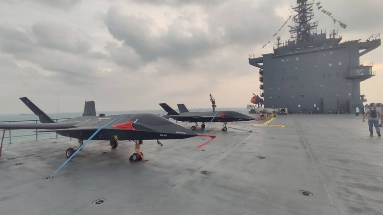 Two Iranian JAS-313 drones stationed on the flight deck of the Shahid Bagheri carrier.