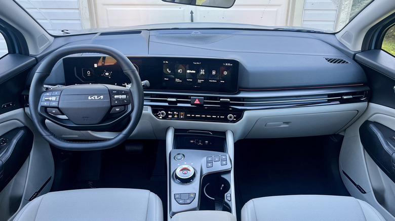 The high-tech dashboard of the 2026 Kia Sportage Hybrid featuring dual curved panoramic displays.