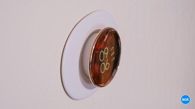 Side profile of the Nest Learning Thermostat 4th Gen illustrating the floating glass design.