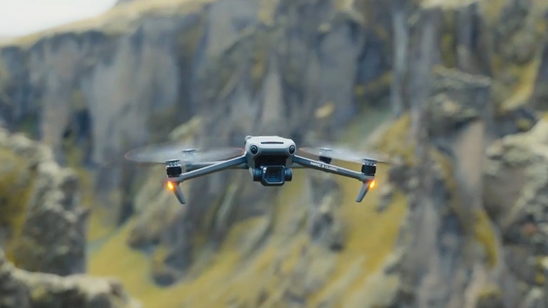 DJI Mavic 3 Classic drone capturing high-altitude mountain scenery.