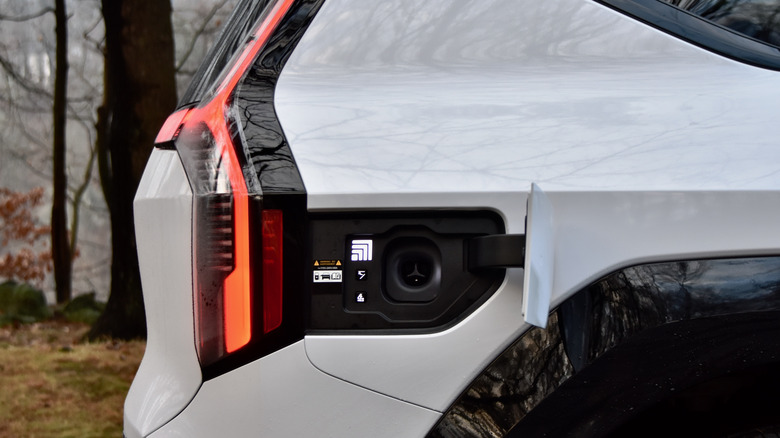 Close-up of the 2026 Kia EV9 charging port area.