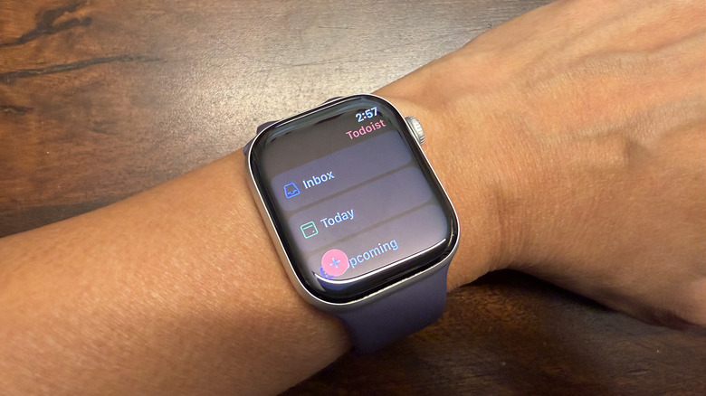 An Apple Watch displaying the Todoist application interface with a list of daily tasks.