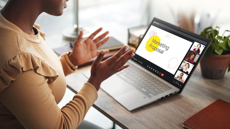 An ASUS Expertbook laptop being used for an online business presentation.