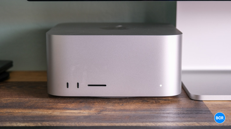 Front view of the 2023 Mac Studio showing the minimalist aluminum chassis and status light.