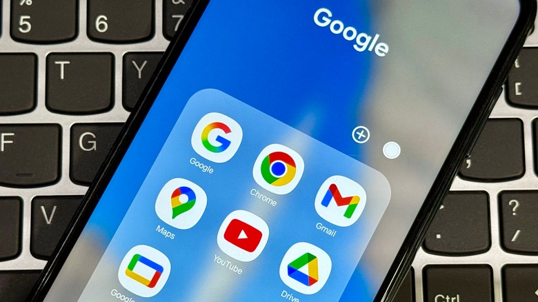An Android smartphone home screen showing the Gmail app icon among various Google productivity tools.
