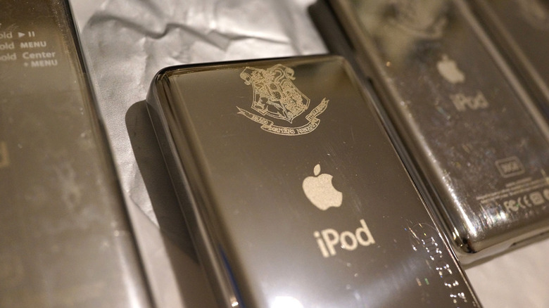 Multiple iPod units featuring the Hogwarts crest laser-engraved on the back.