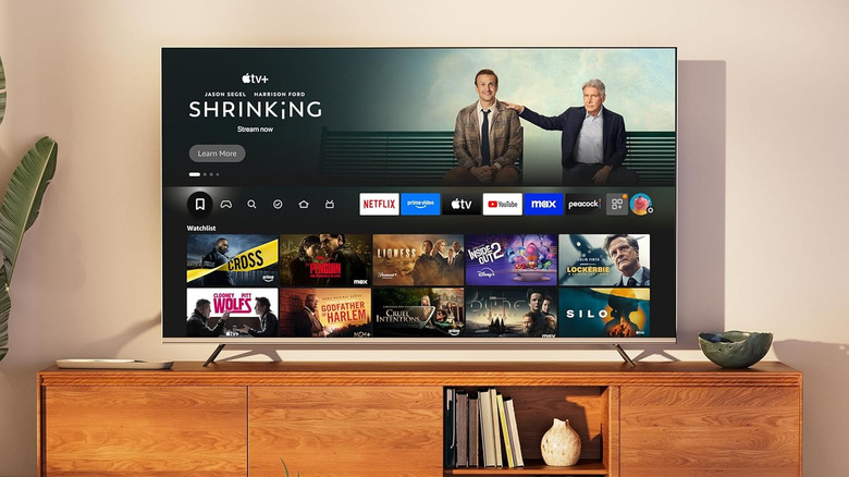 A Hisense U6 Series 4K TV placed on a media console in a bright living room.