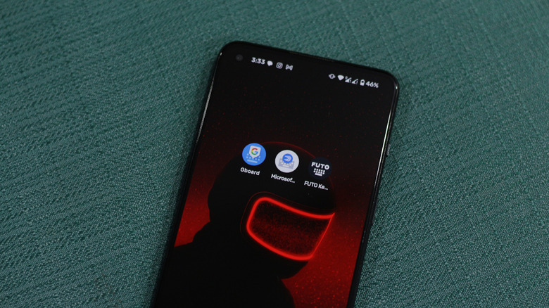 Three Android phones side-by-side displaying Gboard, SwiftKey, and FUTO keyboards respectively.