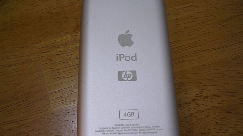 Close-up of an iPod's rear casing featuring the Hewlett-Packard (HP) logo engraved below the iPod branding.
