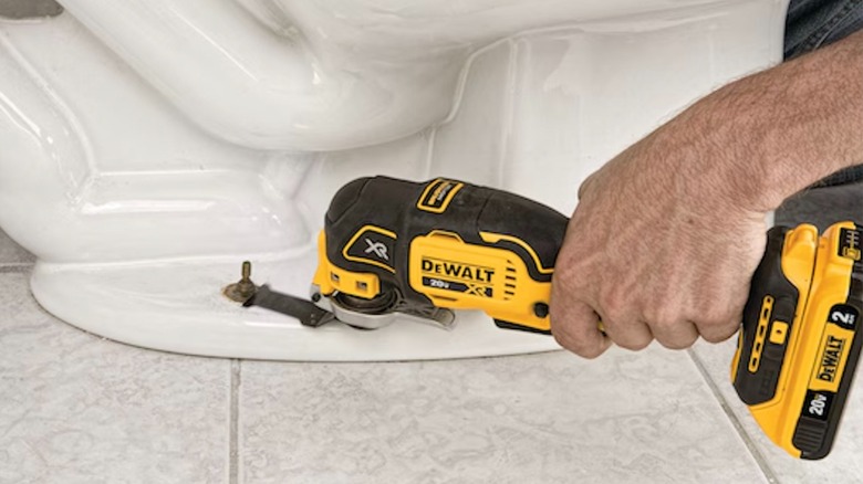 Close-up of the DeWalt 20V Max XR multi-tool highlighting its grip and trigger.