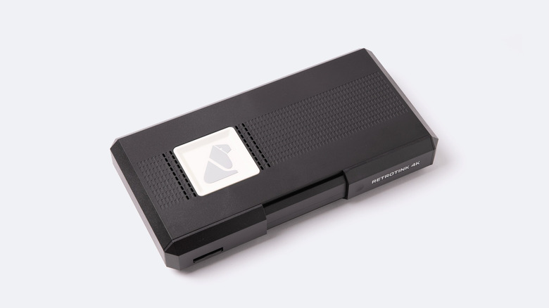 The RetroTINK-4K Pro video processor in a matte black finish.