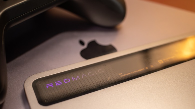 The Redmagic Astra tablet stacked on top of an iPad to show the difference in screen size and form factor.