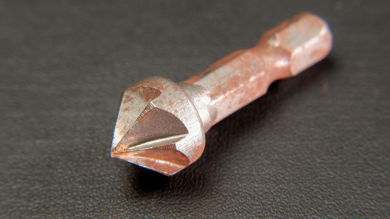 Macro photography of a countersink drill bit tip.