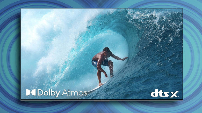 A TCL Q750G TV screen displaying a detailed shot of a surfer on a wave.