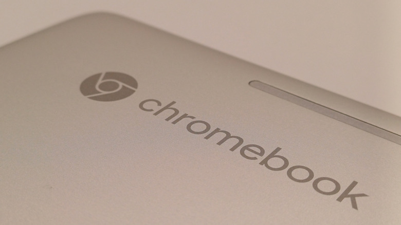 The iconic Google Chrome logo on the lid of a closed Chromebook.