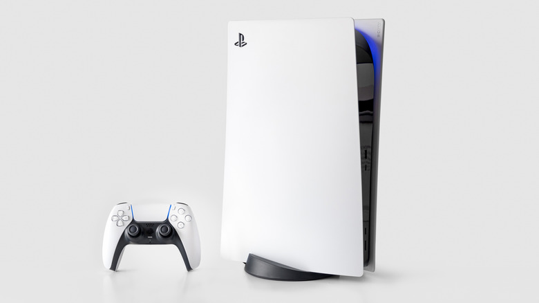 A PlayStation 5 Slim console and its white DualSense controller on a minimalist background.