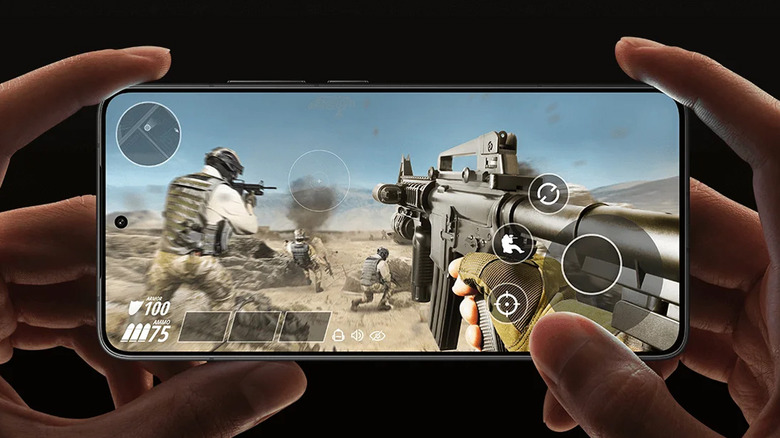 Handheld view of the Poco F7 Pro 5G running a high-action mobile game on its screen.