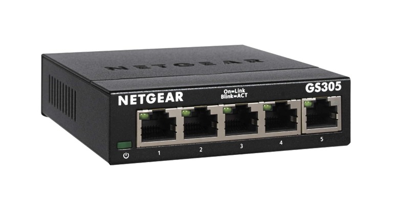 Close-up of a Netgear GS305 unmanaged ethernet switch highlighting the five available ports.