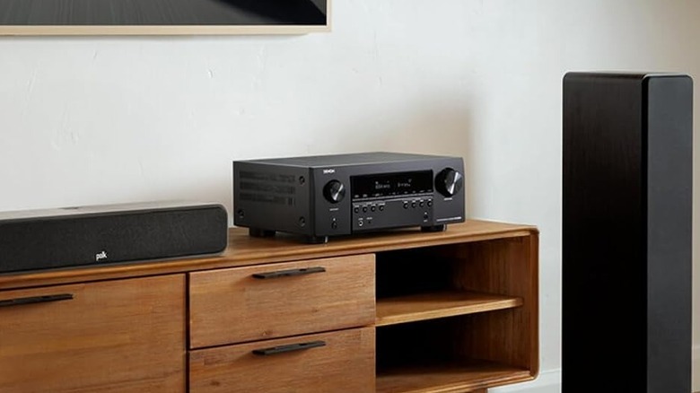 A Denon AVR-S970H receiver powering a modern home theater setup.