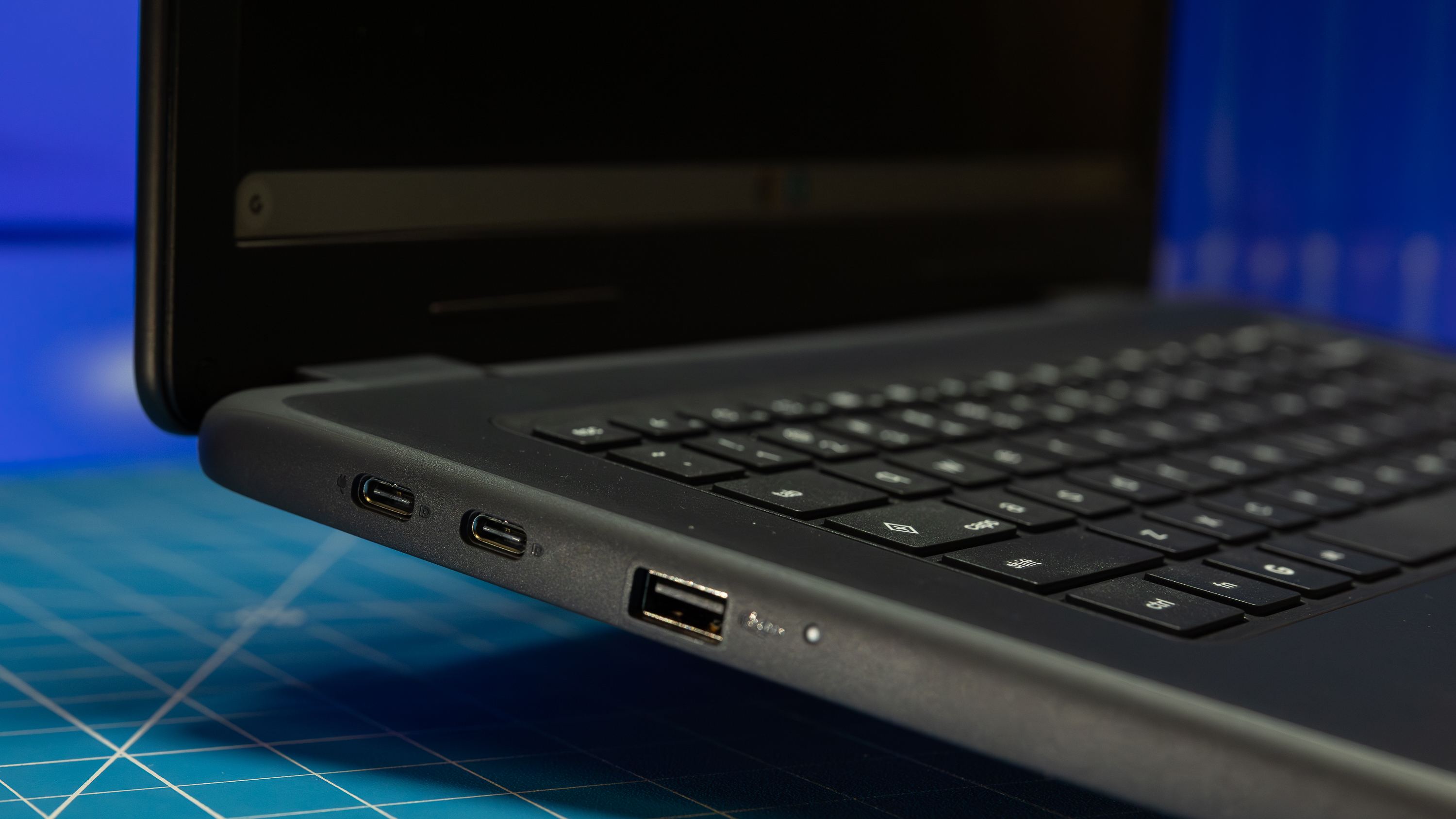 The left side view of the Dell Chromebook 14 showing I/O ports including USB-C and USB-A.