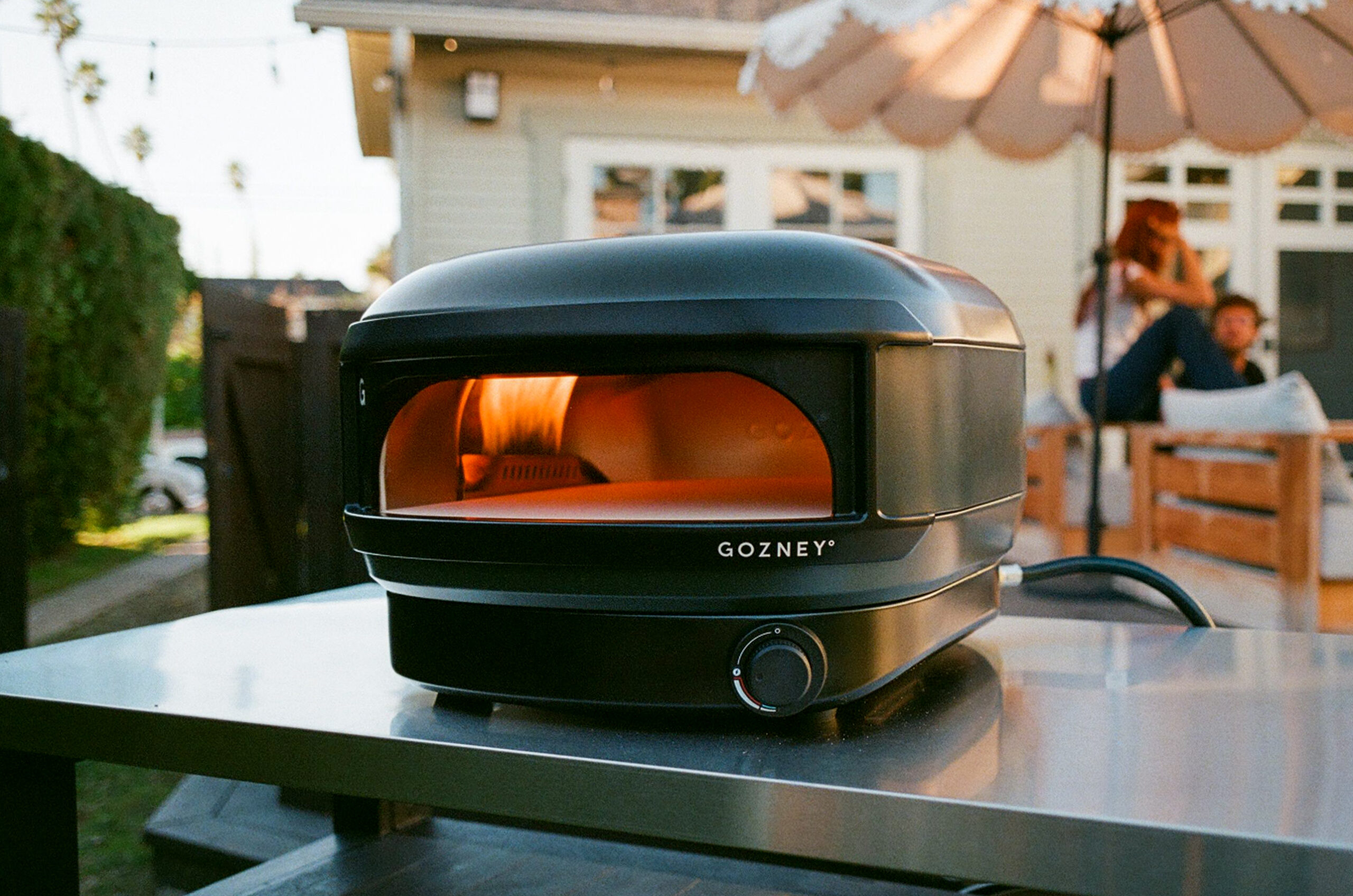 A Neapolitan pizza with charred leopard spotting being cooked inside the oven.