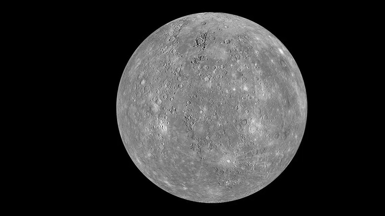 Close-up of the desolate and cratered gray surface of the planet Mercury.