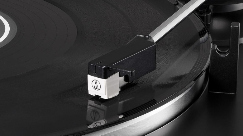 Close-up detail of the Audio-Technica AT-LP60X-BK platter and tonearm assembly.