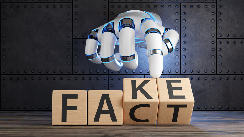A robotic hand flipping blocks to change the word FAKE to FACT against a metallic tech background.