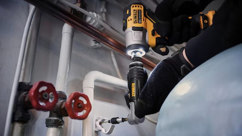 The DeWalt Modular Right Angle Drill Attachment system showing its compact head design.