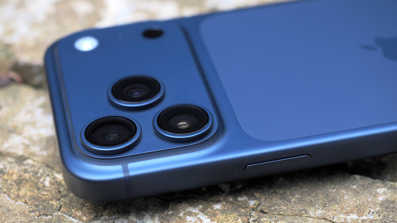 Macro view of the triple-lens rear camera array on the iPhone 17 Pro.