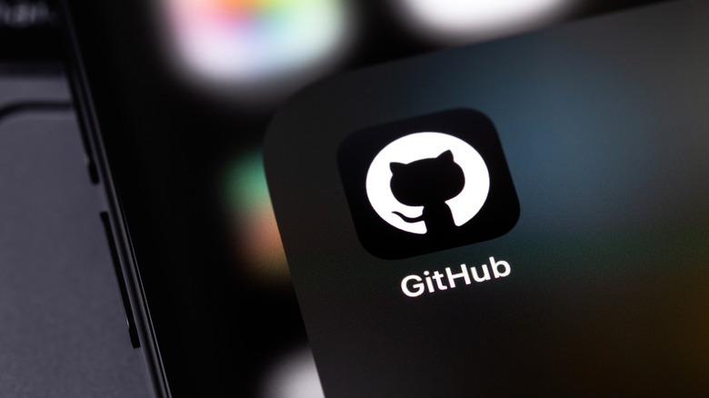 The GitHub app icon with its iconic Octocat logo on a smartphone.