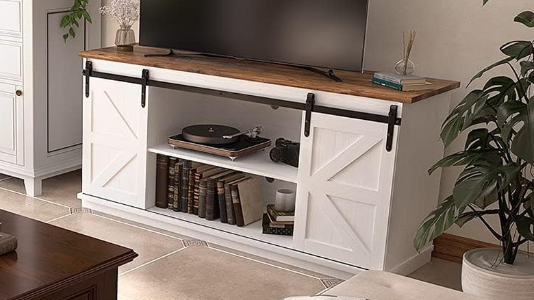 Jummico TV stand with sliding barn doors revealing a record player inside.