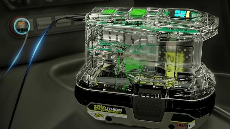 The SYMIK Ryobi battery adapter being used for charging inside a vehicle environment.