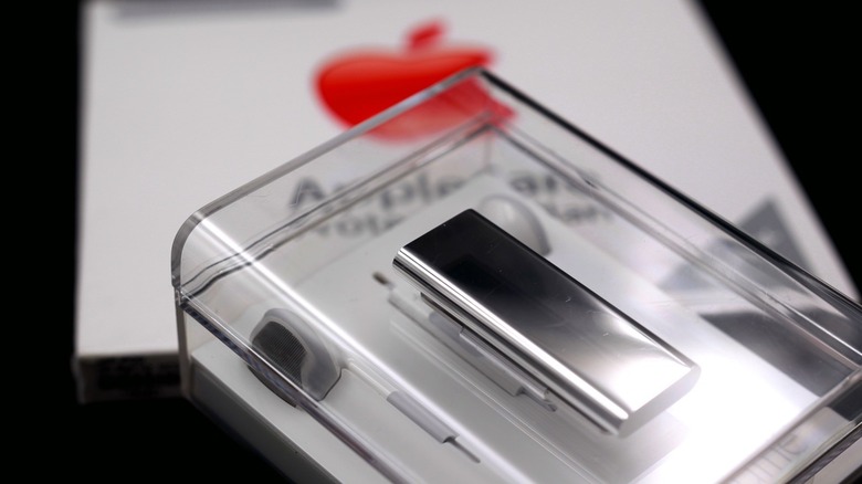 Brand new stainless steel iPod Shuffle in original translucent packaging.
