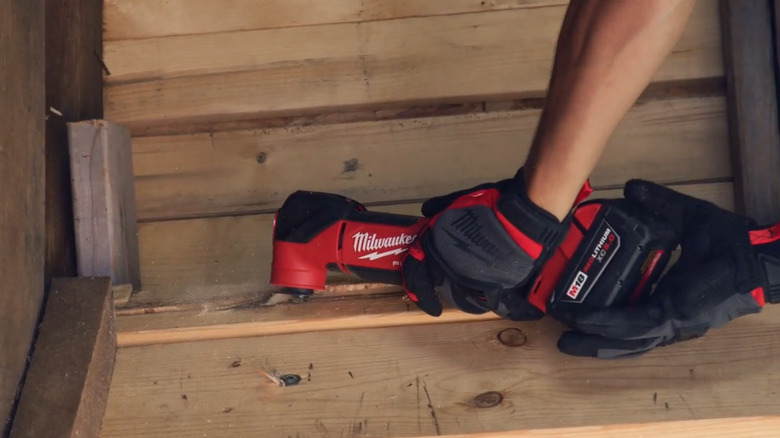 Milwaukee M18 Fuel 2836-20 oscillating tool performing a plunge cut.
