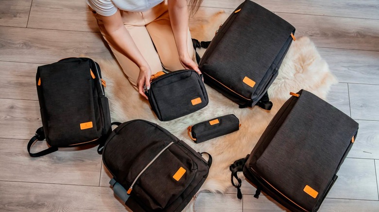 A top-down view of several black Nordace Siena Pro backpacks.