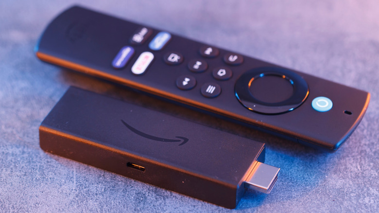 Close-up of the Amazon Fire TV Stick 4K hardware and remote control.