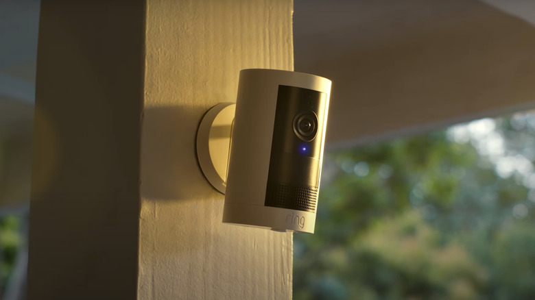 A Ring Outdoor Cam Plus mounted on a white architectural pillar.