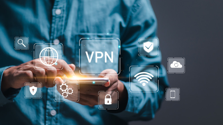 A hand holding a smartphone while toggling a VPN connection to the 'on' position.