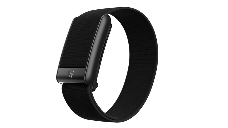 The Whoop 5.0 with a black knit strap and no screen.