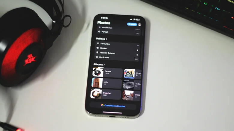 The Apple Photos app library displayed on an iPhone screen.